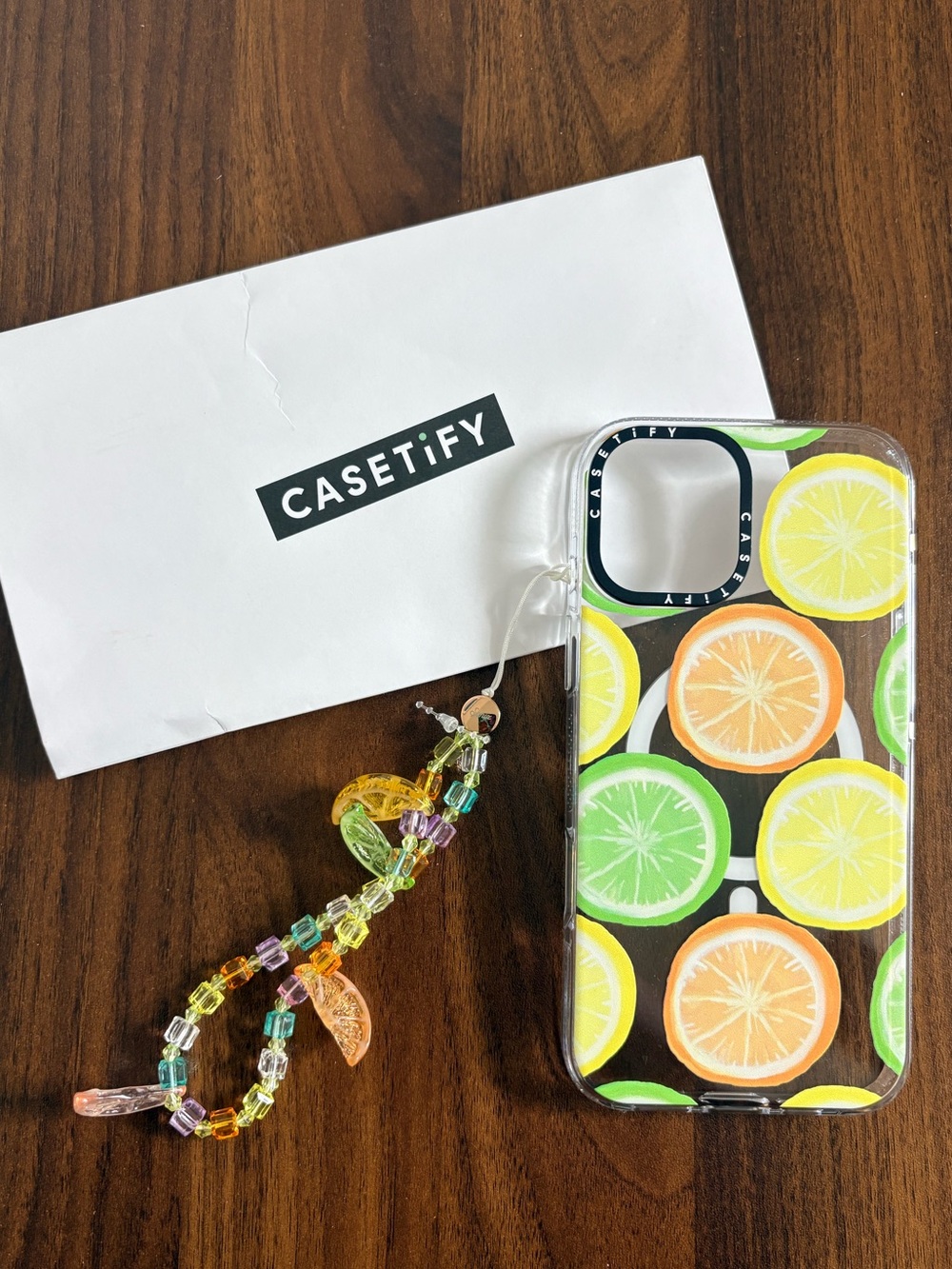 Casetify citrus phone case and charm for iPhone 16 Plus